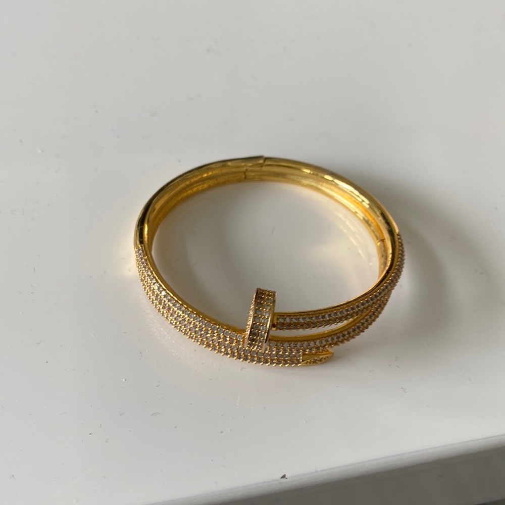 Faux gold and diamond bracelet with nail detail